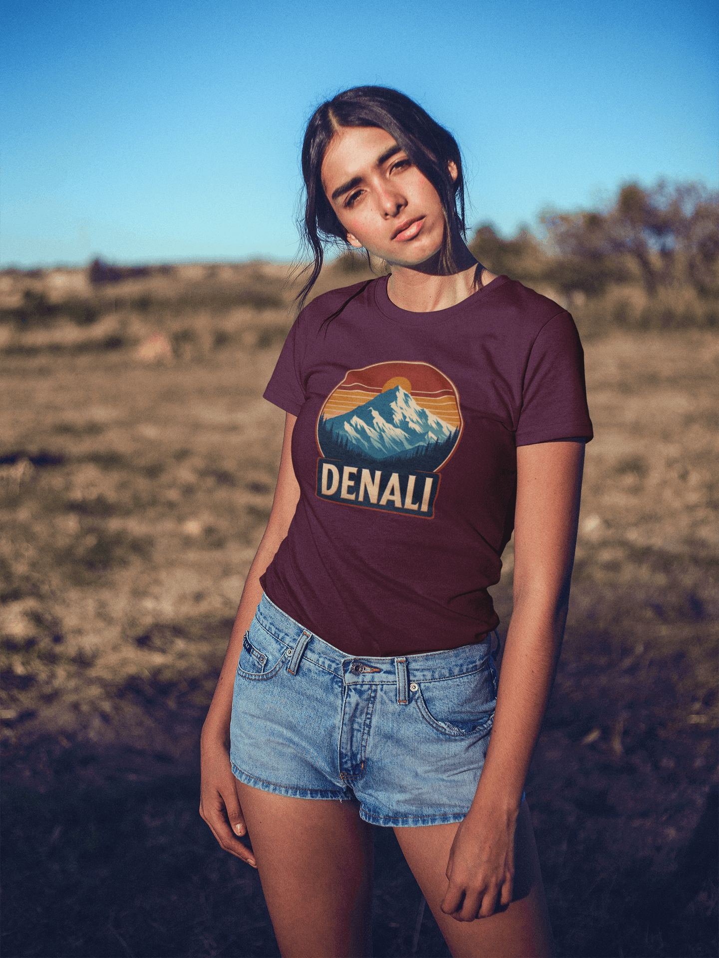 Woman in California wearing Wyld Peak Denali National Park organic cotton tee in maroon.