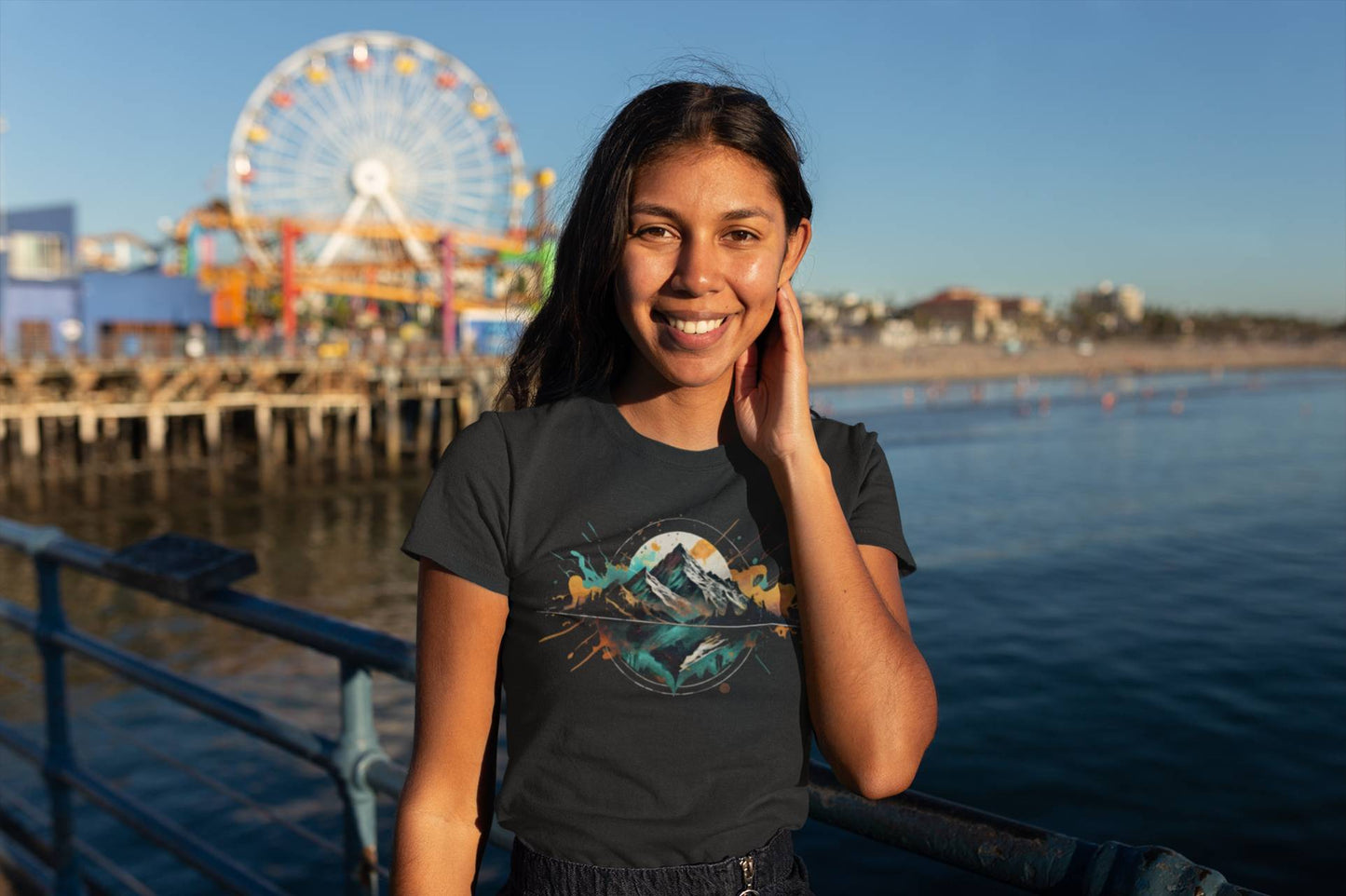Wide shot of woman modeling Wyld Peak organic tee on pier in Los Angeles