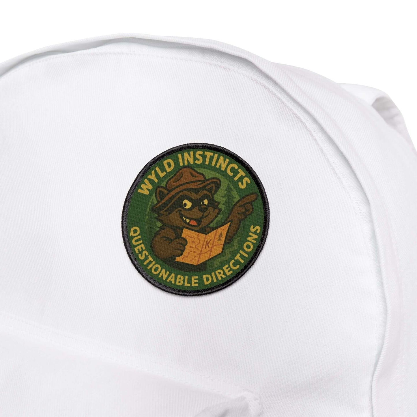 Wyld Peak raccoon-themed patch on a white hiking backpack