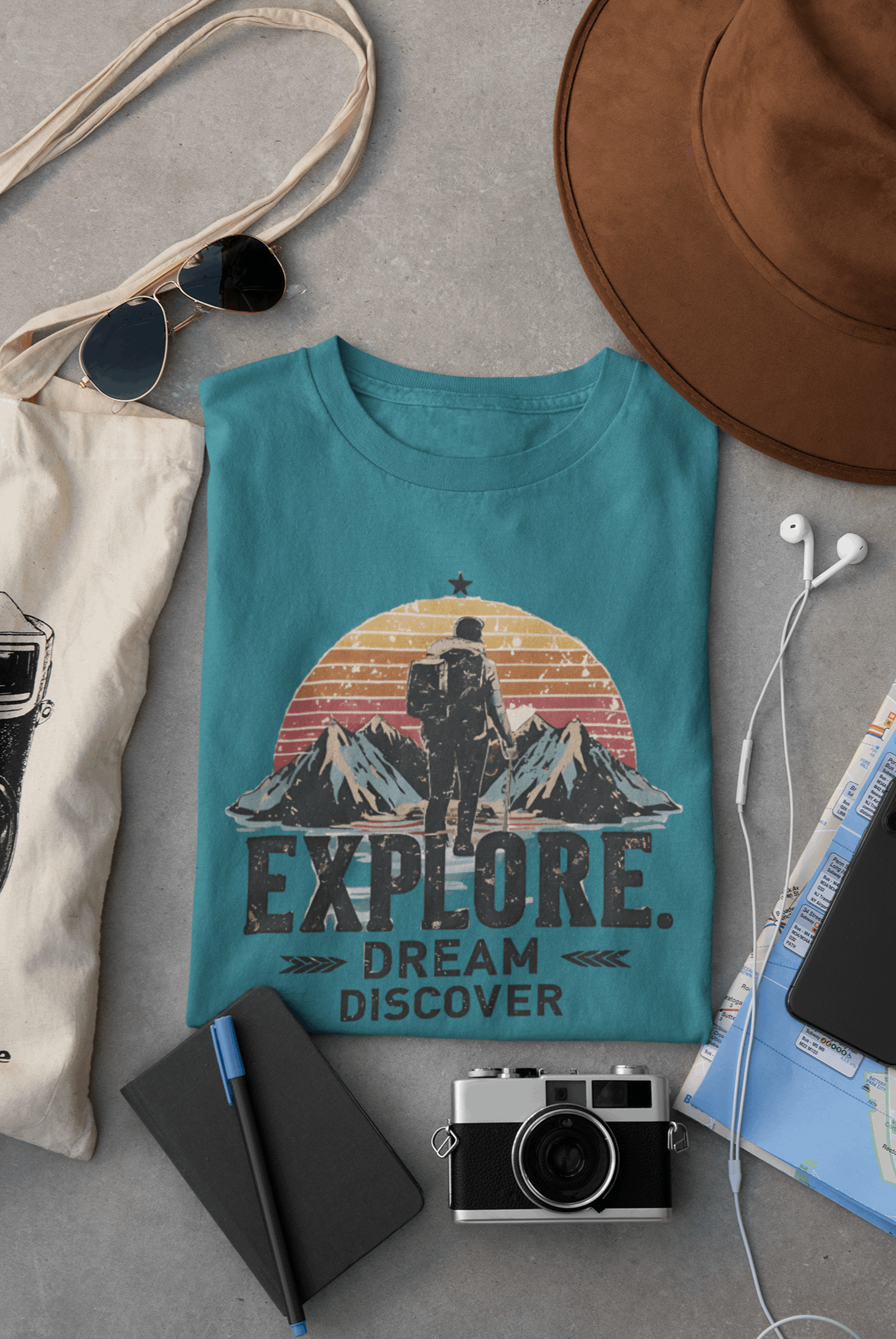 Wyld Peak Explorers men’s organic cotton t-shirt in heather galapagos laid flat on a desk