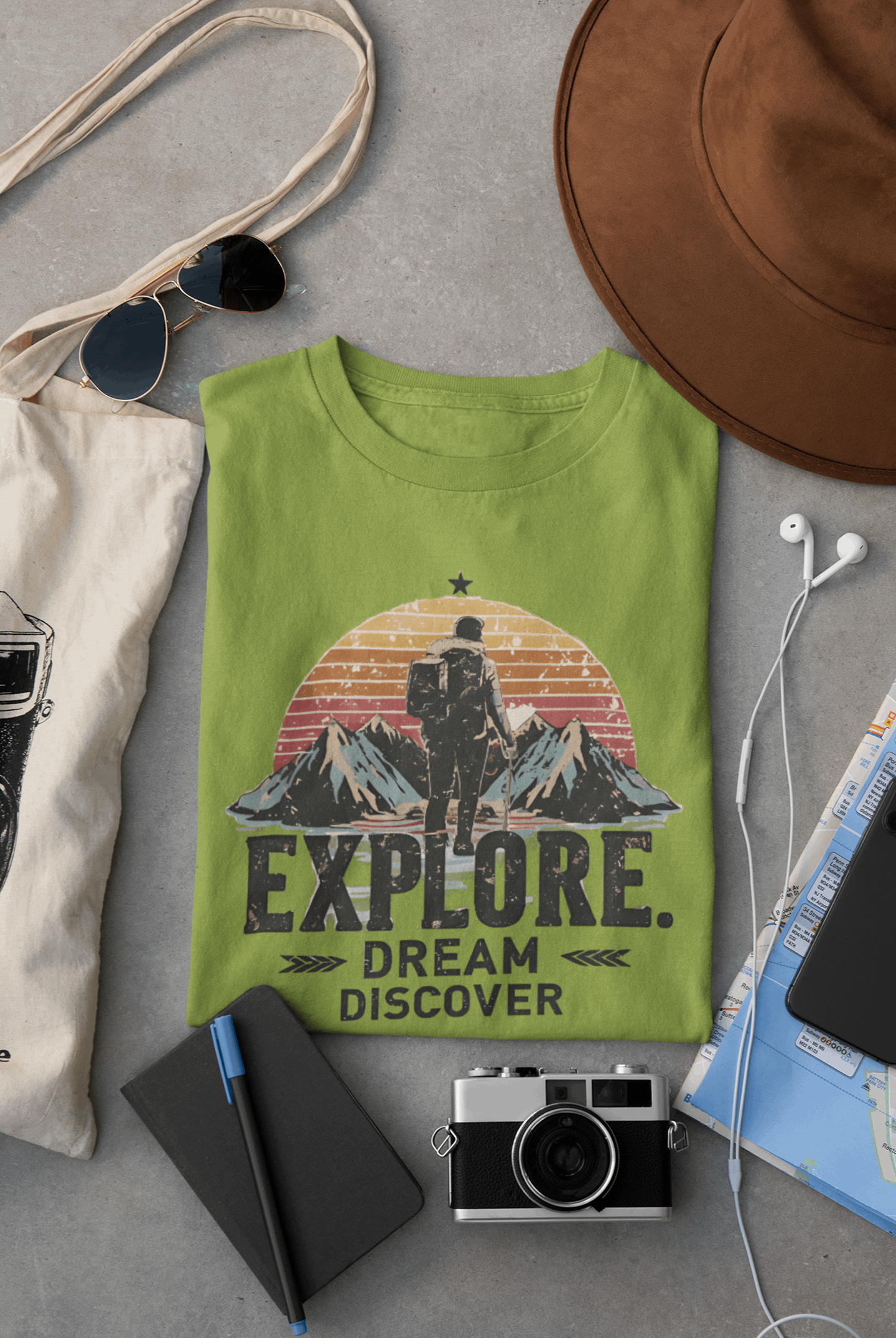 Wyld Peak Explorers men’s organic cotton t-shirt in lime green laid flat on a desk
