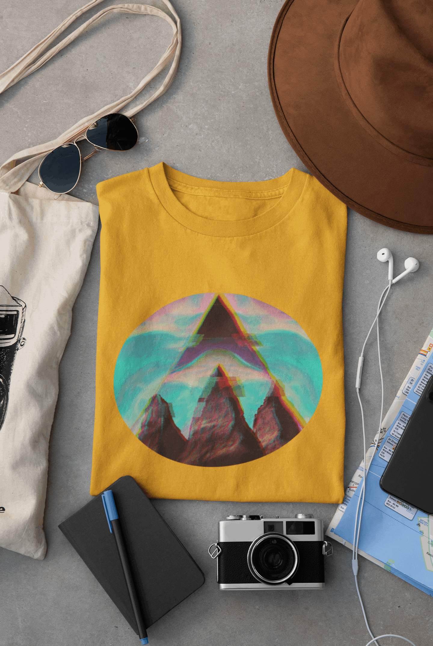 Wyld Peak Fusion men’s organic cotton t-shirt in yellow laid flat on a desk