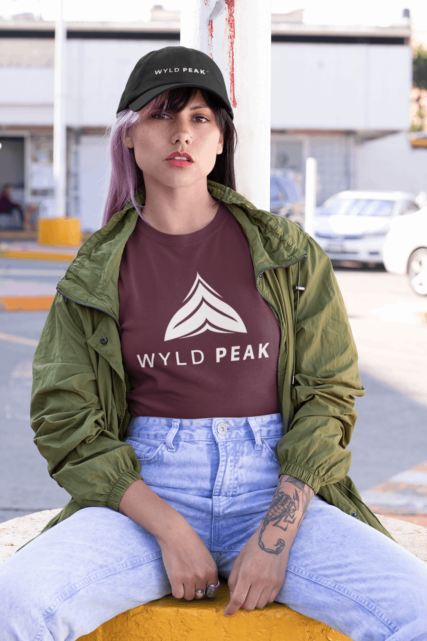 Woman in casual wear wearing maroon Wyld Peak Active tee in San Francisco