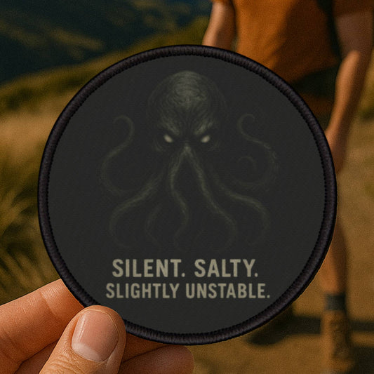 Cthulhu patch photographed outdoors on a rugged hiking trail