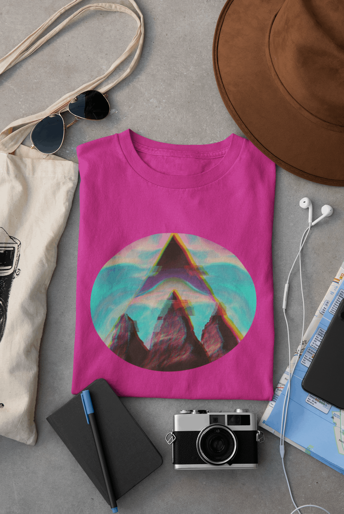 Wyld Peak Fusion Peak Men’s Tee in pink laid flat on a desk