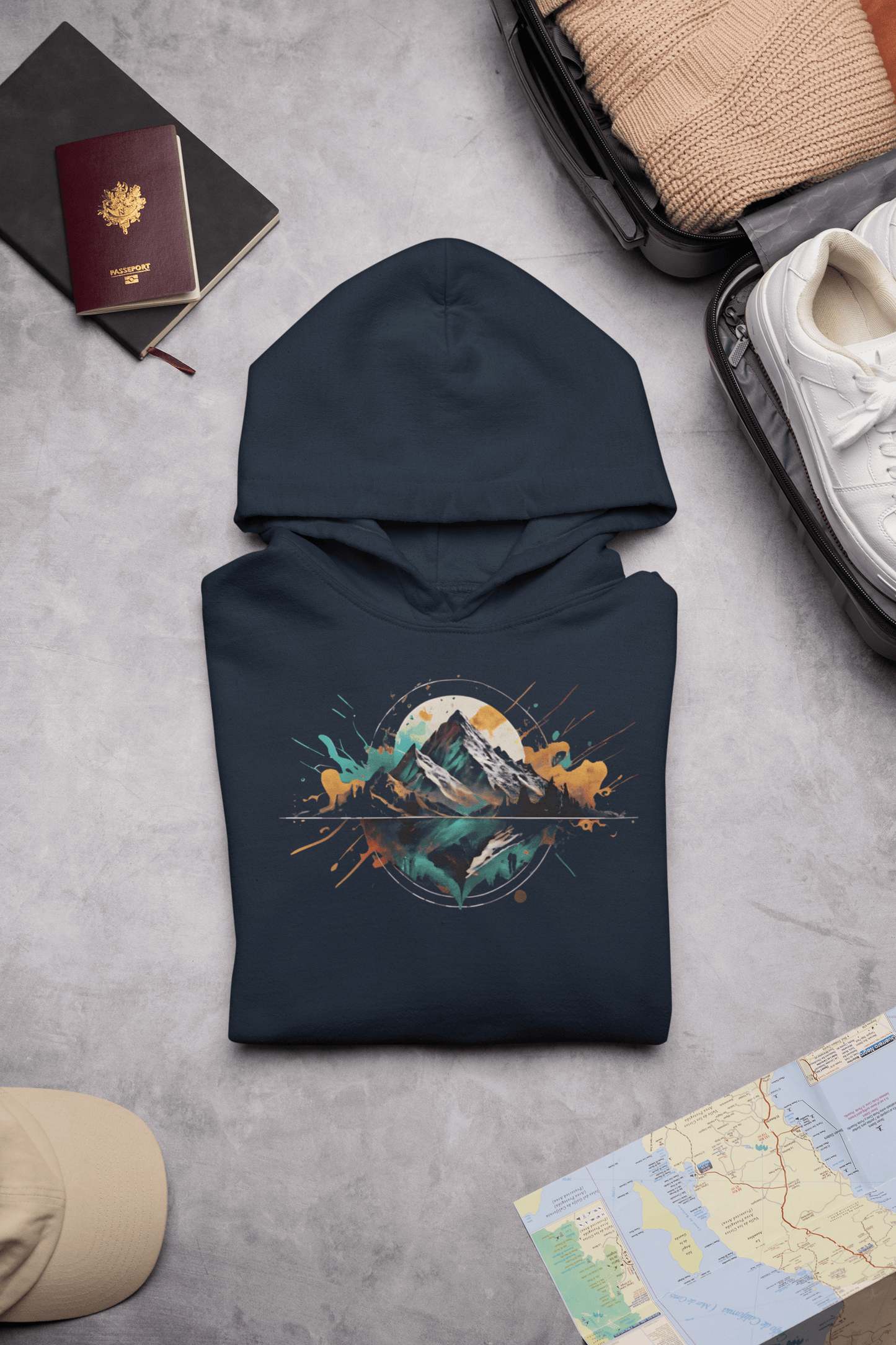 Wyld Peak Peak Design hoodie in navy laid flat on desk.