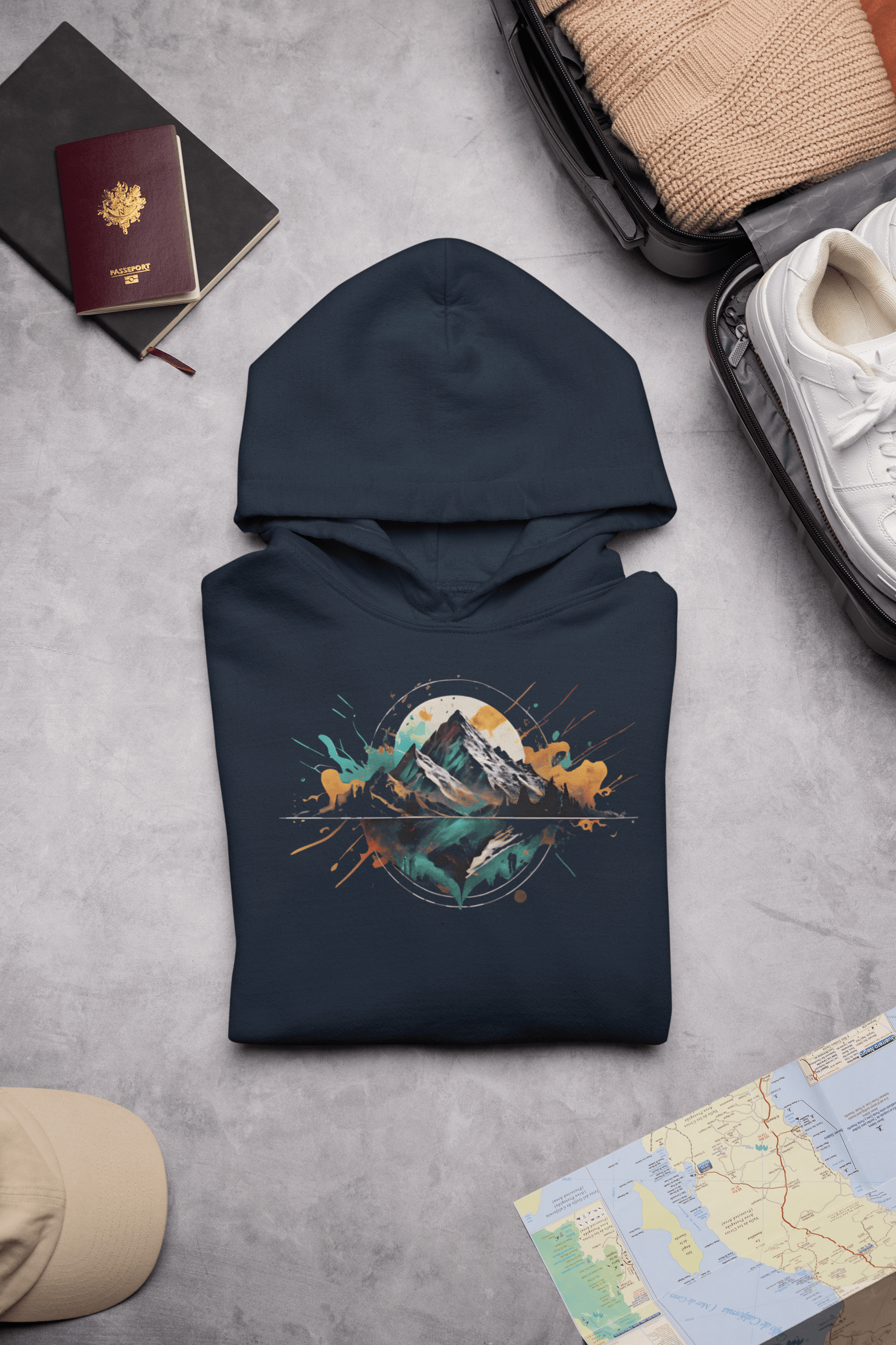 Wyld Peak Peak Design hoodie in navy laid flat on desk.