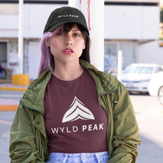 Woman wearing maroon Wyld Peak logo tee in downtown Los Angeles.