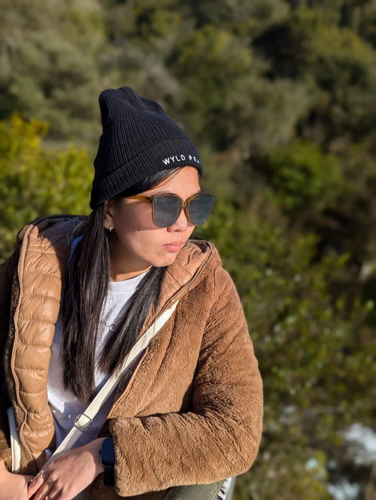 Ann in a Wyld Peak organic beanie at Huka Falls, New Zealand.